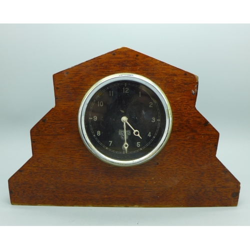 645 - A Smiths car clock movement in a case, from a Bentley