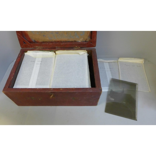 655 - A box of 100 half plate glass plate negatives, many with named buildings
