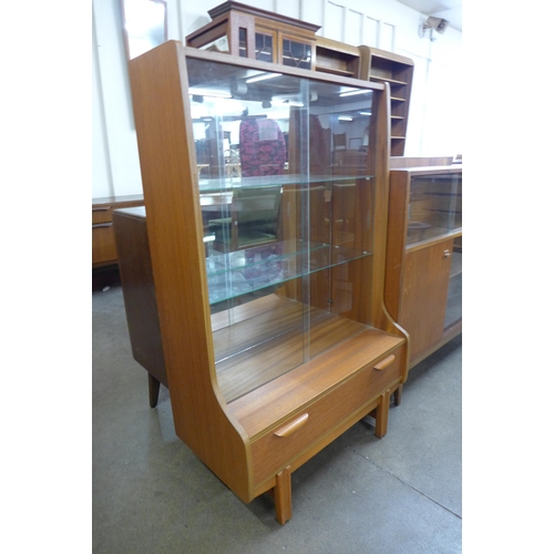 11 - A teak display cabinet