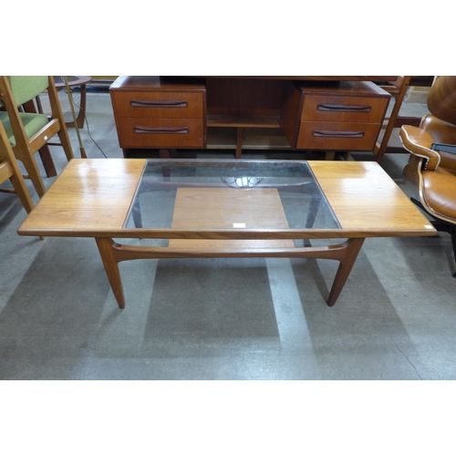 18 - A G-Plan Fresco teak and glass topped coffee table