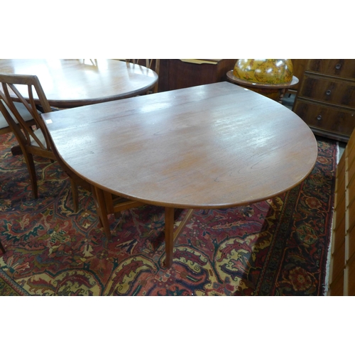32 - A teak drop-leaf dining table