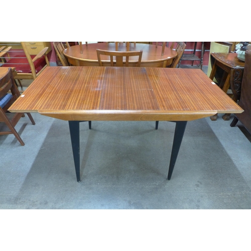 35 - A tola wood and black extending dining table