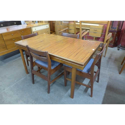38 - A White & Newton teak extending dining table and four chairs