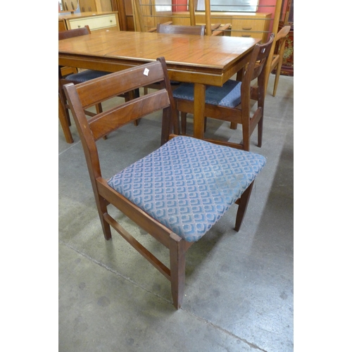 38 - A White & Newton teak extending dining table and four chairs