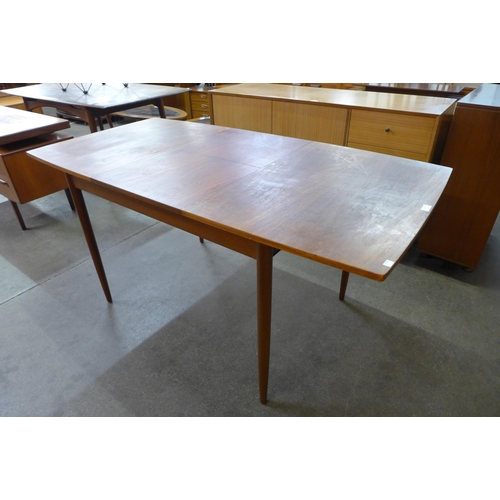 46 - A Greaves and Thomas teak extending dining table