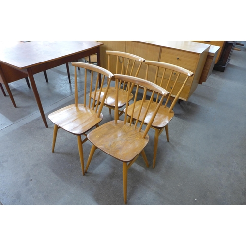 50 - A set four Ercol Blonde elm and beech 737 model chairs and a beech refectory table