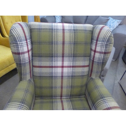 1325 - A tartan upholstered wingback armchair