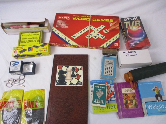 A Large Lot Of Bric A Brac Including Vintage Board Games Unused Video Tapes Books Ect