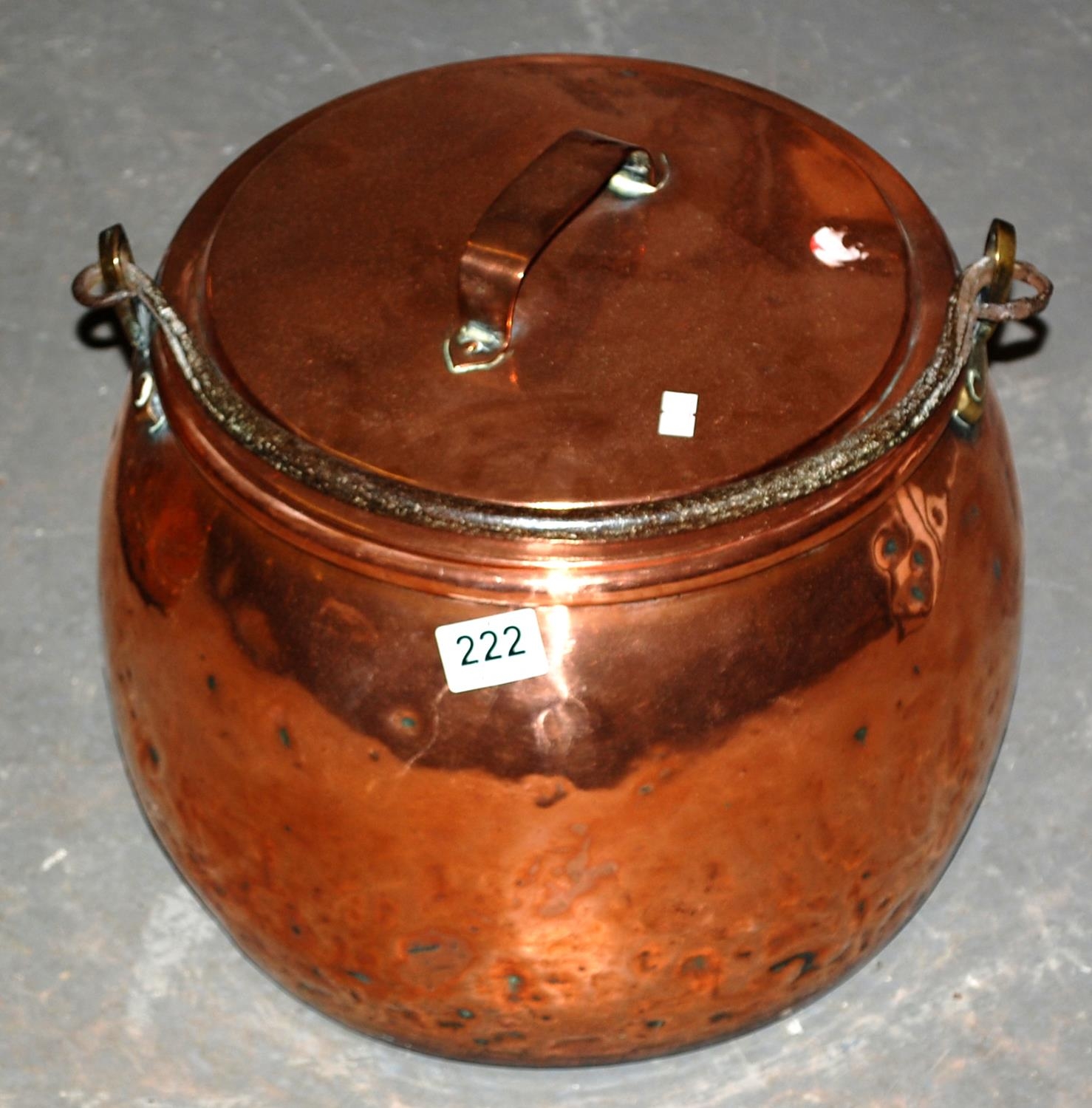 A large antique copper cooking pot