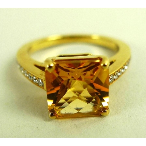 816 - An 18K gold, diamond and citrine solitaire dress ring, the square cut citrine of approximately 8 by ... 