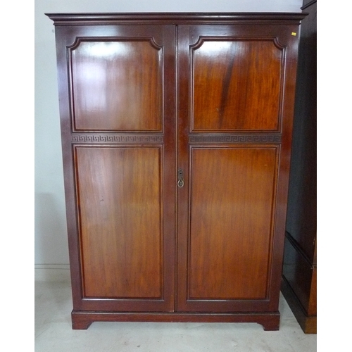 A Mahogany Compactum Wardrobe Circa 1960 With Blind Carved Greek