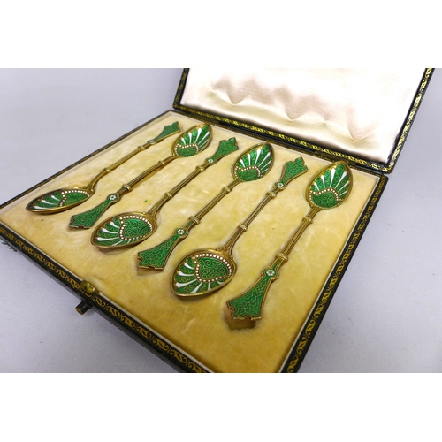 22 - A set of six Art Nouveau Norwegian silver-gilt and green and white enamel teaspoons, marked WFB, lik... 