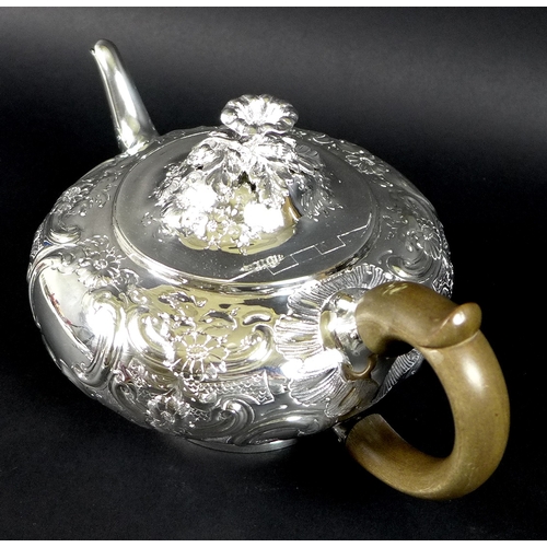 36 - A George III silver teapot, decorated in Rococo style with repousse foliate and floral scrolls, Rich... 