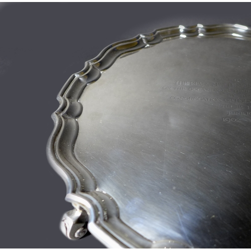 37 - A George V silver salver tray, of circular form with Chippendale pie crust edge, presentation engrav... 