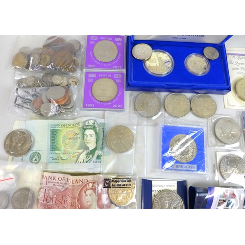 45 - A collection of coins including a silver £1 proof coin, various £5 coins and various silver coins. (... 