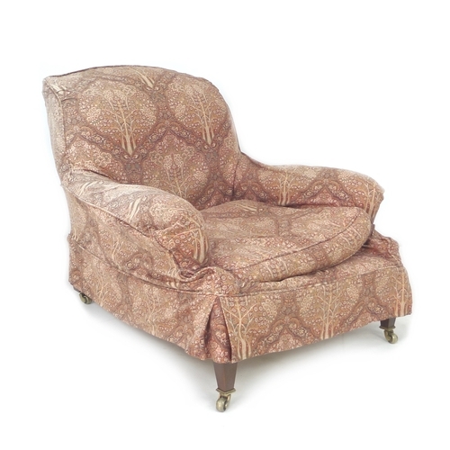 386 - An Edwardian mahogany easy armchair, probably Howard & Sons, Grafton model, with shaped back and ser... 