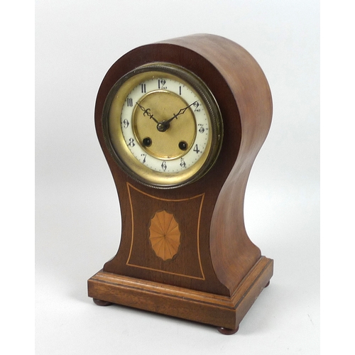 124 - An Edwardian mahogany balloon shaped mantel clock, inlaid with shell paterae, 8 day movement chiming... 