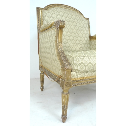 289 - A pair of late 19th century French giltwood armchairs, with carved gilt frames, upholstered in cream... 