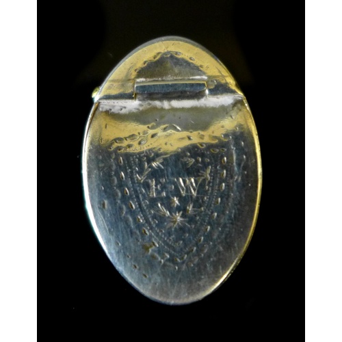 26 - A George III silver oval pill box, with hinged lid, bright cut decoration to lid and sides, bearing ... 