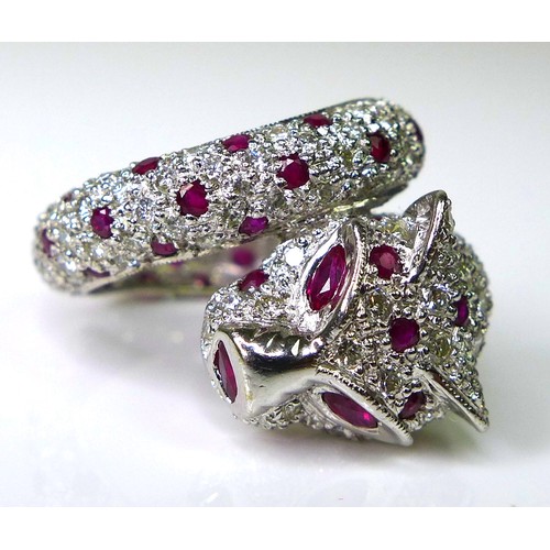 200 - A 18ct white gold, diamond and ruby ring in the form of a coiled panther, by Brooks & Bentley, Londo... 
