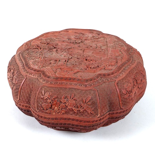 22 - A Chinese early 20th century large box and cover, likely red resin, made to resemble cinnabar lacque... 
