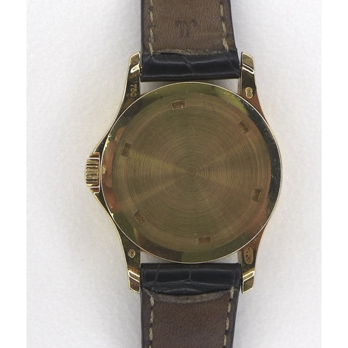 96 - A Patek Philippe Calatrava 18k gold cased lady's wristwatch, reference 4906, circa 2006, the circula... 