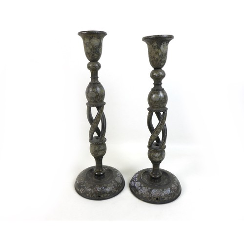 103 - A pair of Persian style wooden candlesticks,