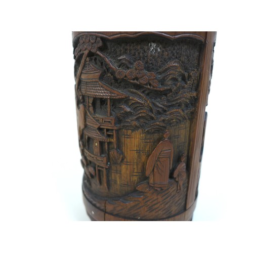 8 - An early 20th century Chinese bamboo brush pot (bitong), of cylindrical form, carved with a landscap... 