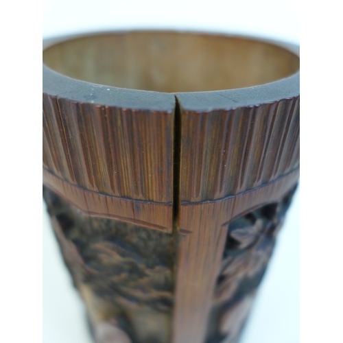 8 - An early 20th century Chinese bamboo brush pot (bitong), of cylindrical form, carved with a landscap... 