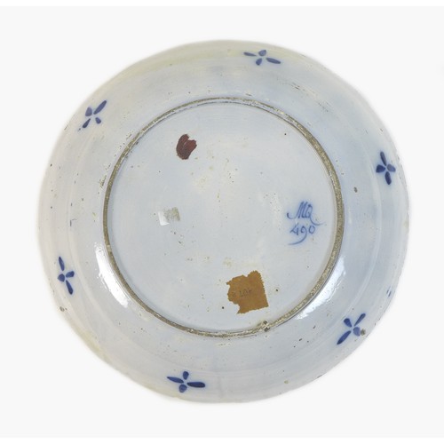 46 - An 18th century Dutch blue and white tin glazed charger, decorated with a bird to the central reserv... 