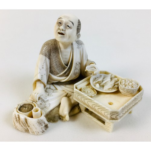 1 - A Japanese Meiji period ivory okimono, late 19th century, finely modelled as man seated and eating f... 
