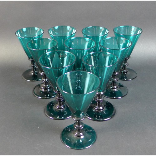60 - A set of ten Regency Bristol green wine glasses, with conical bowls and knopped stems, rough pontil ... 