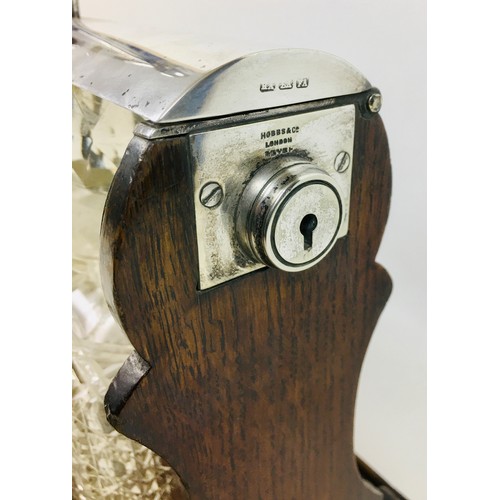 62 - An Edwardian Atkin Bros oak tantalus, with EPNS mounts, a Hobbs & Co. lock, currently unlocked and w... 