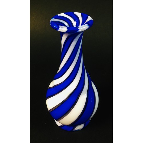 49 - An early Victorian hand blown milk glass vase, of raised wrythen twisted form, possibly Stourbridge ... 