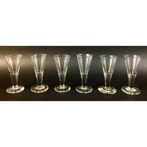 57 - A collection of 18th century and later drinking glasses, including a Georgian ale glass, the rounded... 
