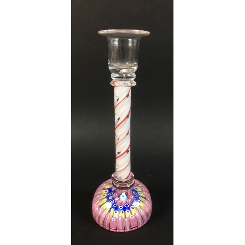 53 - A glass candlestick with candy twist stem in white red and clear glass and millefiore paperweight ba... 