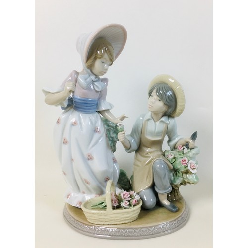 32 - A group of four Lladro figurines, comprising a Lladro figural group 'For you' 5453, 'Fragrant bouque... 