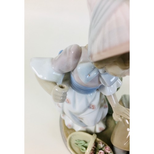 32 - A group of four Lladro figurines, comprising a Lladro figural group 'For you' 5453, 'Fragrant bouque... 