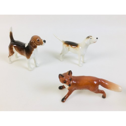 35 - A collection of thirteen Beswick figurines, including a fox, 10 cm by 3.3 by 5.5cm high, two hounds,... 