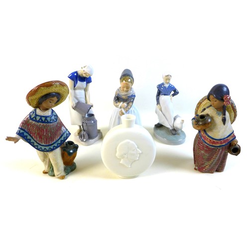33 - A group of five figurines and a moon flask, comprising Lladro figurine 'Pedro with jug' matte, 12141... 