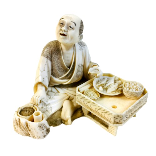 1 - A Japanese Meiji period ivory okimono, late 19th century, finely modelled as man seated and eating f... 