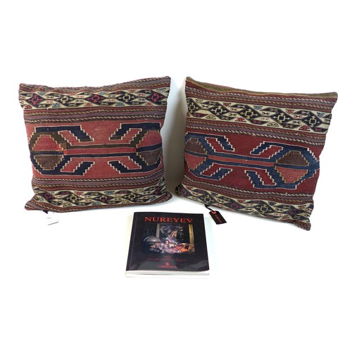 268 - A pair of cushions covered in kilim once belonging to Rudolf Nureyev, each 45 by 43cm, with original... 