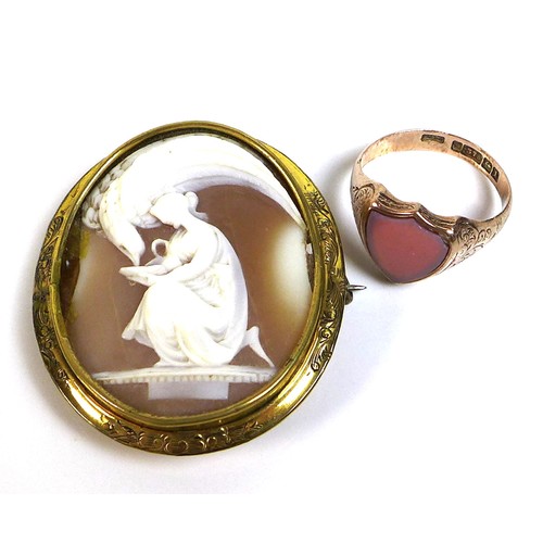 321 - An Edwardian 9ct gold signet ring, with shield eschutcheon set with polished shell and engraved foli... 