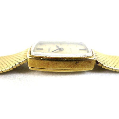 212 - A Tissot Stylist 18ct gold cased lady's wristwatch, circa 1970s, the cushioned rectangular dial with... 