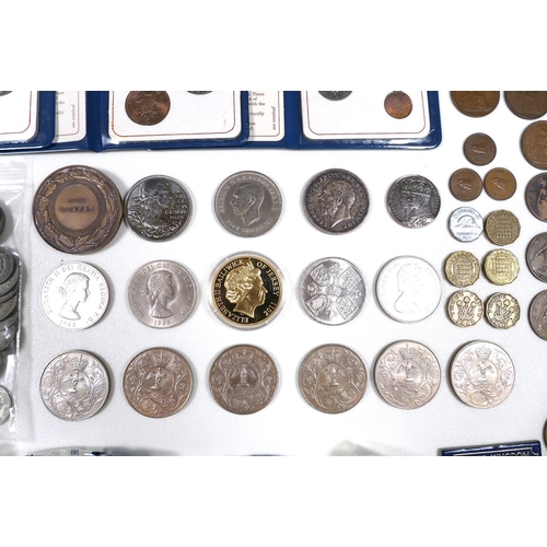 61 - A group of coins, including a 1935 rocking horse crown, a 2012 £5 coin, a 2005 Trafalgar £5 coin, so... 