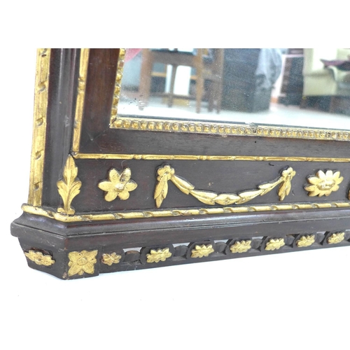 241 - An early 19th century giltwood framed wall mirror, with a carved giltwood surmount of foliate and fl... 