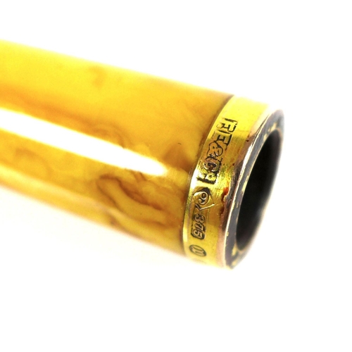 157 - A mid 20th century 9ct gold mounted amber cheroot holder, with yellow metal band to its middle, a/f,... 