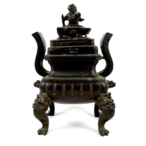 1 - A Chinese bronze censer, late Ming / early Qing Dynasty, of archaic form with two high stylised hand... 