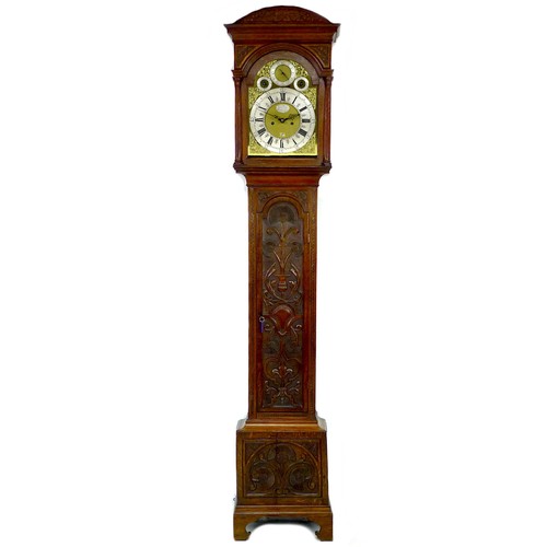 A George III tall oak long case clock, by John Tyler, Strand, London, 11½" engraved brass dial, silvered chapter ring, applied spandrels, twin train 8 day five pillar movement with crown escapement, carved case, with pendulum, winder, case key, and two weights, 44 by 24 by 237cm high.