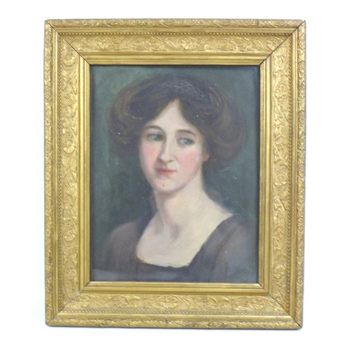 41 - A portrait of an Edwardian lady, looking to her left, wearing a brown dress, inscription to the back... 